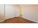 Bedroom with wood floors, baseboards, and large closet at 22993 W Micah Way, Buckeye, AZ 85326