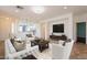 Inviting living room with tile floors, recessed lighting, and an open floor plan at 22993 W Micah Way, Buckeye, AZ 85326