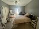 Spacious bedroom featuring plush carpet, ceiling fan, walk in closet, and ensuite desk at 2311 E Hartford Ave # 38, Phoenix, AZ 85022