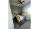 Well-lit bedroom with ceiling fan, carpet, and a warm and inviting atmosphere at 2311 E Hartford Ave # 38, Phoenix, AZ 85022