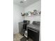 The laundry room includes a washer and dryer with overhead shelving for storage at 2311 E Hartford Ave # 38, Phoenix, AZ 85022