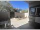 Private outdoor patio space with concrete floors and partial block wall offers a relaxed seating and gardening area at 2311 E Hartford Ave # 38, Phoenix, AZ 85022