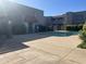 A well-maintained community pool with a sun deck, safety fence, and mature landscaping offers resident enjoyment at 2311 E Hartford Ave # 38, Phoenix, AZ 85022