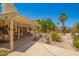 Spacious backyard featuring lush landscaping, a patio and desert plants at 2409 S Chestnut Pl, Chandler, AZ 85286