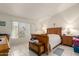 Bedroom with a wooden sleigh bed and natural light from the window at 2409 S Chestnut Pl, Chandler, AZ 85286