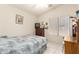 Comfortable bedroom featuring a window, tile floors, and ceiling fan at 2409 S Chestnut Pl, Chandler, AZ 85286