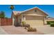 Single story home featuring a two-car garage and desert landscaping at 2409 S Chestnut Pl, Chandler, AZ 85286