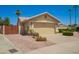 Single story home featuring a two-car garage and desert landscaping at 2409 S Chestnut Pl, Chandler, AZ 85286