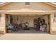 Spacious two-car garage featuring ample storage, work area, and tools at 2409 S Chestnut Pl, Chandler, AZ 85286