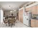 Eat-in kitchen with tile floors and an adjacent living room at 2409 S Chestnut Pl, Chandler, AZ 85286