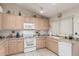 Kitchen area with appliances and tile flooring at 2409 S Chestnut Pl, Chandler, AZ 85286