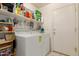 Functional laundry room with shelving and a door leading outside at 2409 S Chestnut Pl, Chandler, AZ 85286