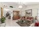 Bright living room featuring tile floors, a chandelier and comfortable seating at 2409 S Chestnut Pl, Chandler, AZ 85286