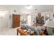 Cozy living room featuring a brick fireplace, tile floors, and comfortable furniture at 2409 S Chestnut Pl, Chandler, AZ 85286