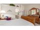 Main bedroom with wooden furniture and access to an ensuite bathroom at 2409 S Chestnut Pl, Chandler, AZ 85286