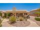 Enclosed patio area with stone walkway, drought-resistant landscaping, and a barbecue grill at 2409 S Chestnut Pl, Chandler, AZ 85286