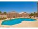 Backyard pool with stone trim, privacy fence and low-maintenance landscaping at 2409 S Chestnut Pl, Chandler, AZ 85286