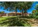 The backyard features a well maintained lawn and the exterior of the home at 2956 E Concho Ave, Mesa, AZ 85204