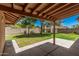 Covered patio overlooks the grass backyard, perfect for outdoor living and entertaining at 2956 E Concho Ave, Mesa, AZ 85204