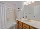 A full bathroom with shower and tub combination with a single sink and storage underneath at 2956 E Concho Ave, Mesa, AZ 85204