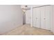 A secondary bedroom has a large closet with built-in bi-fold doors at 2956 E Concho Ave, Mesa, AZ 85204