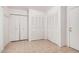 Hallway featuring tile flooring, access to the front door, and large closet at 2956 E Concho Ave, Mesa, AZ 85204