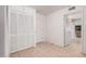 Hallway featuring tile flooring, closet space, and access to another room at 2956 E Concho Ave, Mesa, AZ 85204