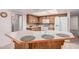 Functional kitchen features a convenient island with breakfast bar and ample cabinet space at 2956 E Concho Ave, Mesa, AZ 85204