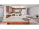 Inviting kitchen boasts an island with a breakfast bar and a bright, airy atmosphere at 2956 E Concho Ave, Mesa, AZ 85204