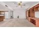 Bright living room showcases built-in shelving and opens to the adjacent kitchen at 2956 E Concho Ave, Mesa, AZ 85204