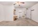 A spacious primary bedroom features neutral carpet, a ceiling fan and ensuite bathroom and walk-in closet at 2956 E Concho Ave, Mesa, AZ 85204