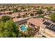 Aerial view of backyard highlighting pool, lush landscaping, and putting green at 2990 N Pearl Ct, Casa Grande, AZ 85122
