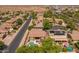 Aerial view featuring neighborhood, desert landscaping, swimming pools, and mountain views at 2990 N Pearl Ct, Casa Grande, AZ 85122