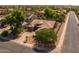 An aerial view of a single-story house with a 3-car garage and tile roof in a well-maintained neighborhood at 2990 N Pearl Ct, Casa Grande, AZ 85122