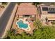 Aerial view showcasing pool, desert landscape, covered patio, and putting green at 2990 N Pearl Ct, Casa Grande, AZ 85122