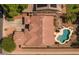 An aerial view of a well-maintained home with a tile roof and a beautiful backyard pool at 2990 N Pearl Ct, Casa Grande, AZ 85122