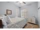 Bright bedroom featuring neutral walls, carpet flooring, and a cozy bed at 2990 N Pearl Ct, Casa Grande, AZ 85122
