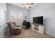 Bedroom setup as an office featuring a cozy recliner, workstation, and closet at 2990 N Pearl Ct, Casa Grande, AZ 85122