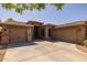 Attractive single-story home featuring a three-car garage and desert landscaping at 2990 N Pearl Ct, Casa Grande, AZ 85122