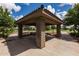 Community gazebo featuring picnic tables and stone support columns, offering a shaded gathering spot at 2990 N Pearl Ct, Casa Grande, AZ 85122