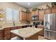 Well-equipped kitchen featuring an island, granite countertops, and ample cabinet space at 2990 N Pearl Ct, Casa Grande, AZ 85122
