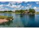 Scenic lake view showcasing a gazebo and lush green landscaping, offering a peaceful retreat at 2990 N Pearl Ct, Casa Grande, AZ 85122
