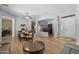 Spacious living area with wood floors, dining area, and a seamless flow to other rooms at 2990 N Pearl Ct, Casa Grande, AZ 85122