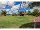 Neighborhood playground with shaded play area and grassy field provides space for recreation at 2990 N Pearl Ct, Casa Grande, AZ 85122