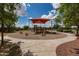 Neighborhood playground featuring climbing structure, spring riders, and sun shade at 2990 N Pearl Ct, Casa Grande, AZ 85122