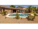 Backyard with a freeform pool, landscaping, patio, and pergola, perfect for entertaining at 2990 N Pearl Ct, Casa Grande, AZ 85122