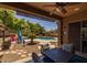 Inviting pool patio with comfortable seating, a pergola, and views of the sparkling pool at 2990 N Pearl Ct, Casa Grande, AZ 85122