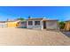 View of the gravel backyard and the exterior of the house at 3118 W Windrose Dr, Phoenix, AZ 85029