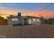 The home features a gravel backyard and a covered patio area at 3118 W Windrose Dr, Phoenix, AZ 85029