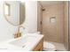 Modern bathroom with gold finishes, a tiled shower, and a white vanity at 3118 W Windrose Dr, Phoenix, AZ 85029